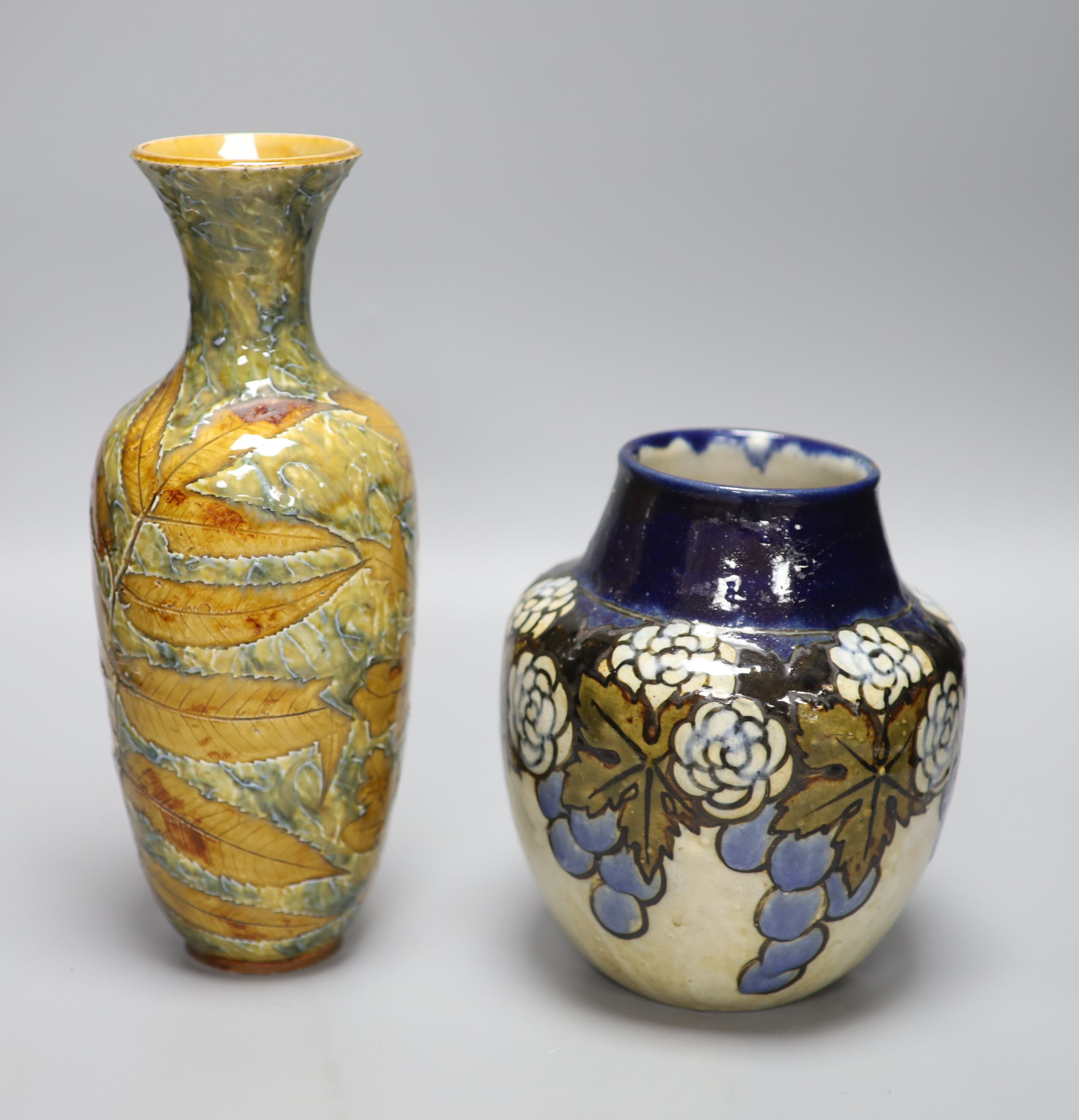 A Doulton Lambeth Autumn leaves vase and a Royal Doulton stoneware vase, tallest 27.5cm